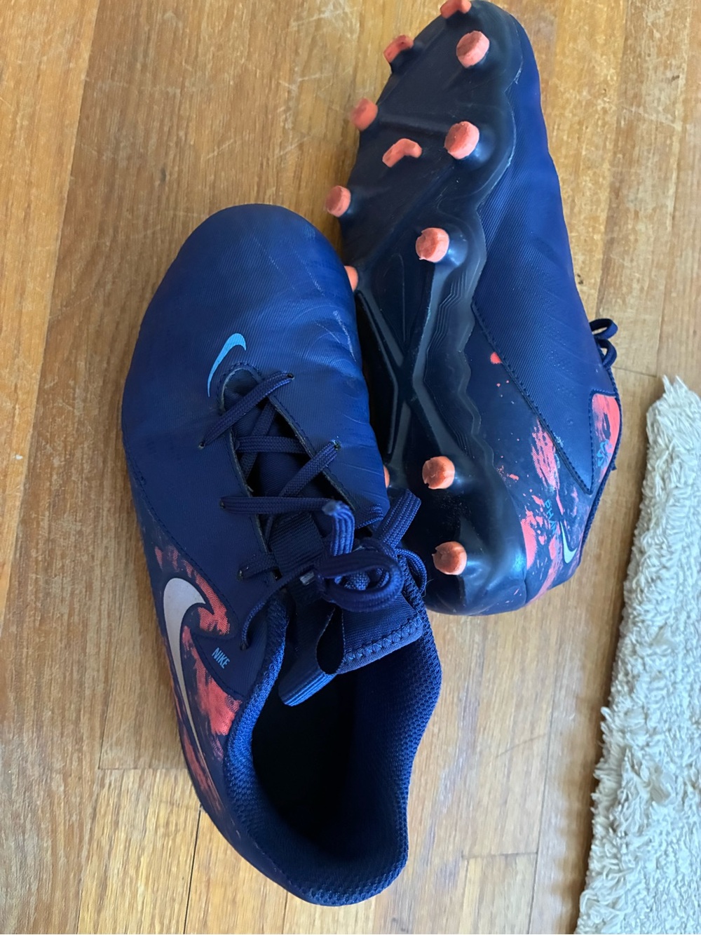 Nike Kids Blue Soccer Cleats with Coral Accents